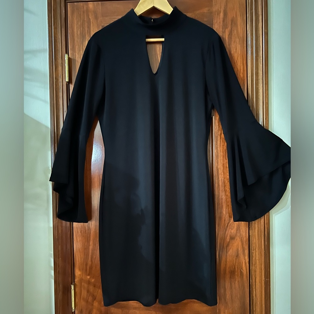 WHITE HOUSE BLACK MARKET Knee Length Dress. Size Medium. Black color.